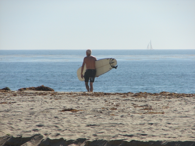 Randy Norquist heading out to surf